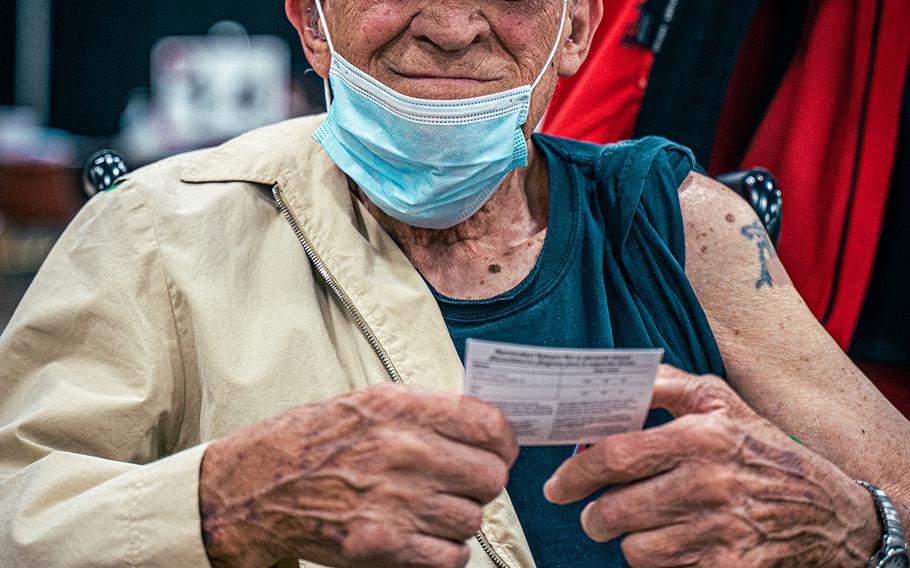 James Gresak, who served in the Navy during World War II, poses for a portrait after receiving his COVID-19 vaccine in Arlington, Texas, March 30, 2021. A study published in the Journal of the American Medical Association on April 8, 2021, found that even before COVID vaccines were widely available in the U.S., many veterans said their psychological outlook on life had improved during the pandemic.