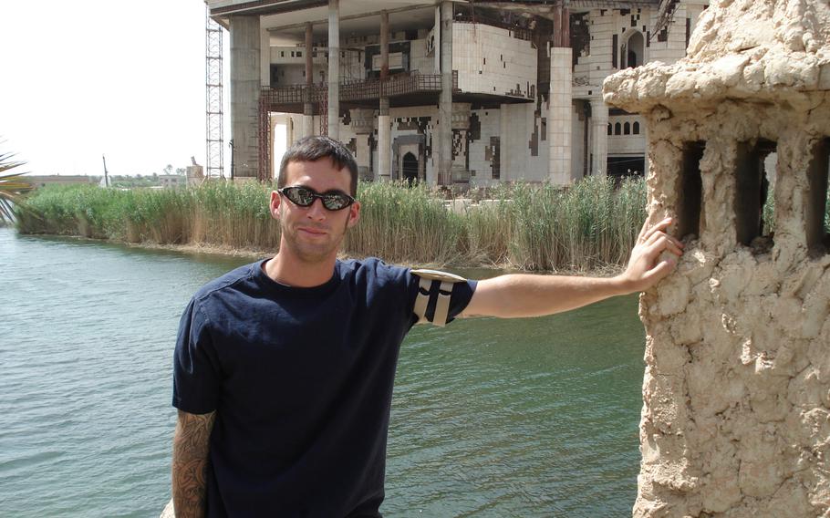 Army Staff Sgt. Mark Jackson poses in front of ''Flintstone Palace'' at Camp Slayer, Baghdad, in 2007. Jackson was exposed to toxins in Iraq, Afghanistan and Uzbekistan when he was deployed after the attacks of 9/11. 

