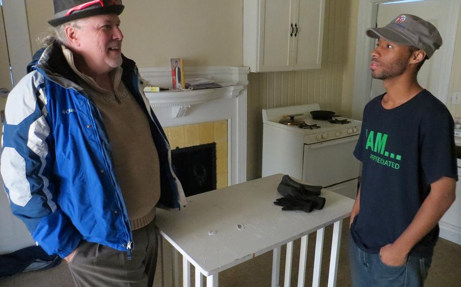Ken Leslie, left, the founder of Veterans Matter, talked with Greg Johnson, an Iraq War veteran, last month in Johnson's apartment in Toledo, Ohio. Leslie's Toledo-based organization paid the $540 rent deposit that helped Johnson, who was homeless last summer, move into the space in September.