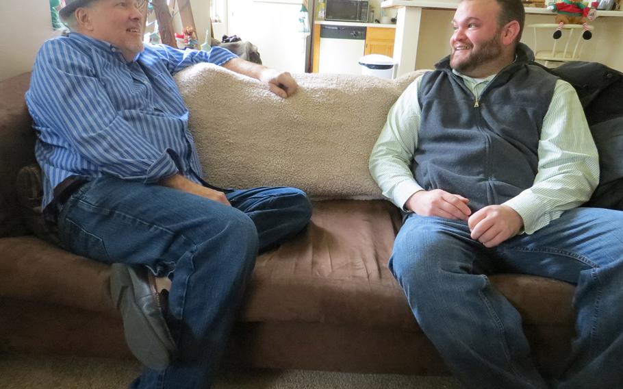 Ken Leslie, left, the founder of Veterans Matter, dropped by the apartment of Army veteran Dave Hammond last month in Toledo, Ohio. Leslie's Toledo-based nonprofit paid the $475 rent deposit that helped Hammond, who had been homeless for two years, move into the space in October.