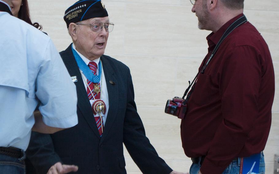 Medal of Honor recipient Hershel Williams speaks to a visitor at the National Museum of the Marine Corps on Feb. 20, 2015. Williams was there with the 70th Anniversary of the Battle of Iwo Jima reunion.