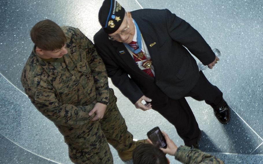 Medal of Honor recipient Hershel Williams speaks to active duty Marine at the National Museum of the Marine Corps on Feb. 20, 2015. Williams was there with the 70th Anniversary of the Battle of Iwo Jima reunion. 