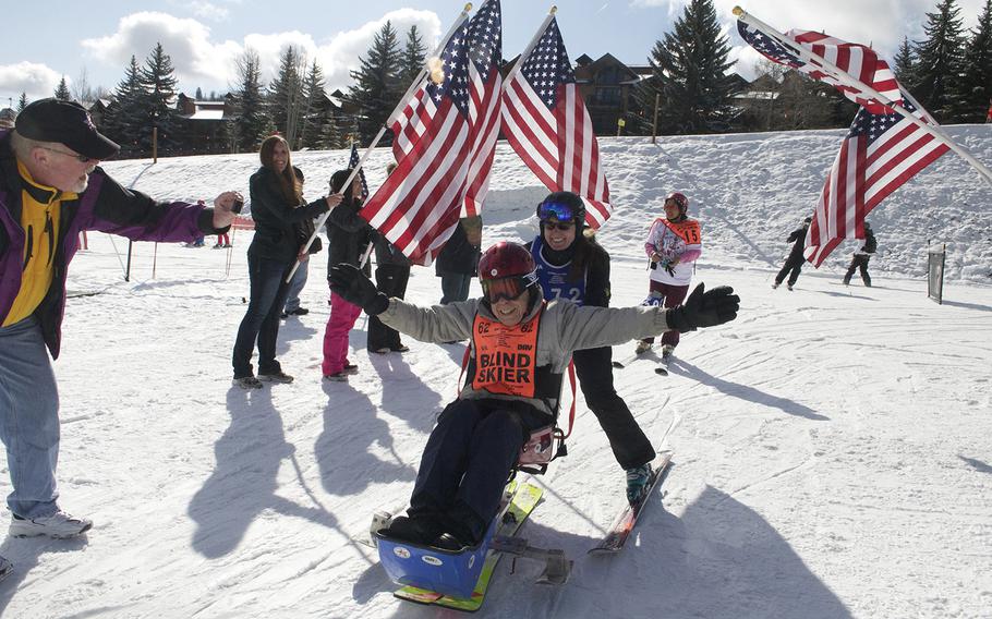 WWII veteran Eugene Puckett, 88, finishes a run in a sit-down ski at the annual National Disabled Veterans Winter Sports Clinic at Aspen Snowmass Resort in Colorado in April 2015. The clinic brings together hundreds of wounded veterans for sports rehabilitation through activities such as skiing, snowboarding, hockey, kayaking and rock climbing.