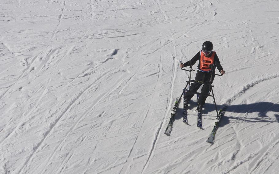 A visually impaired veteran skis at Snowmass Resort in Colorado during the National Disabled Veterans Winter Sports Clinic in April 2015. Veterans of conflicts as far back as WWII participated in the clinic, which has been running since 1987.