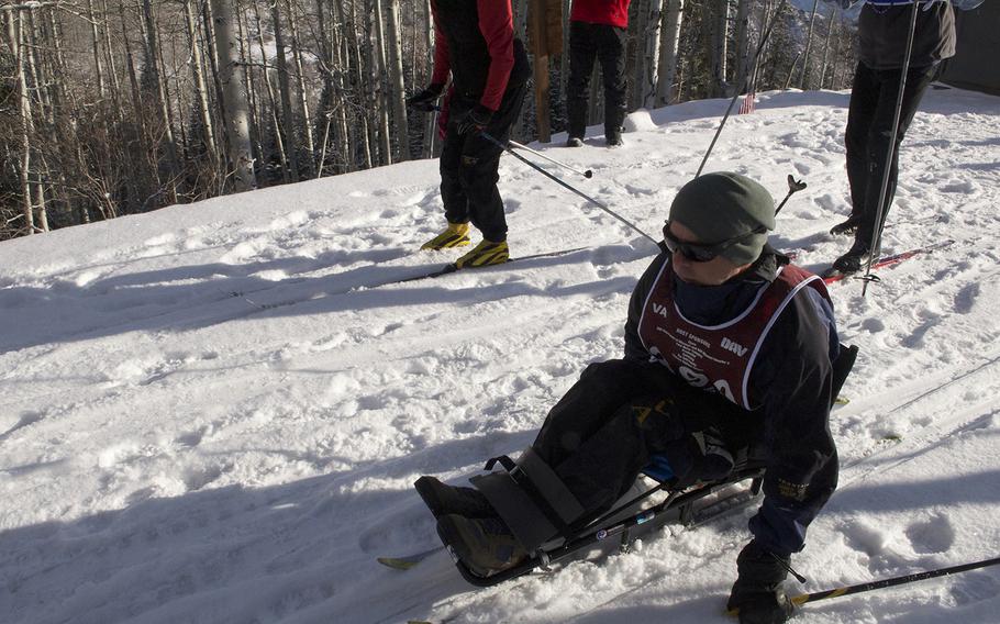 A veteran races the clock during a cross-country ski competition at the National Disabled Veterans Winter Sports Clinic at Aspen Snowmass Resort in Colorado in April 2015.