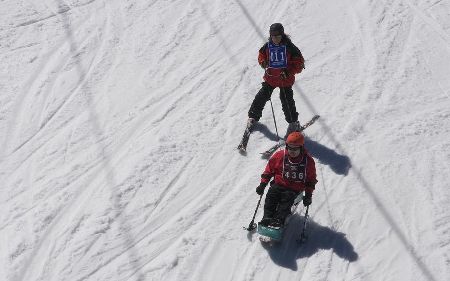 A veteran learns to use a sit-down ski, designed for paralyzed and amputee athletes, during the National Disabled Veterans Winter Sports Clinic at Aspen Snowmass Resort in Colorado in April 2015.