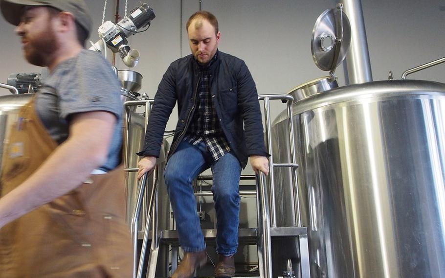 Marine veteran Sean Arroyo checks tanks at his brewery, Hertiage Brewing Co., in Manassas, VA. Arroyo, who served in Iraq, is one of the many post-9/11 veterans starting their own businesses.