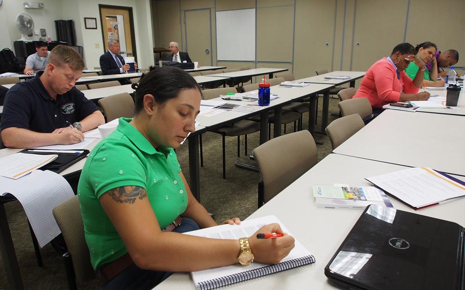 Lt. Maria DeCristoforo, who hopes to open a brewery after leaving the Navy next year, takes notes during a Boots to Business class at Marine Corps Base Quantico Thursday. The program, offered at 165 military installations around the world, is aimed at troops and veterans interested in entrepreneurship.