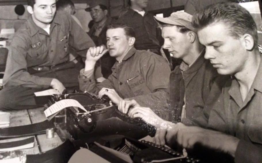 Marine Sgt. Frank Praytor, second from left, works with other Stars and Stripes combat correspondents in Munsan-ni, Korea, in April 1953.