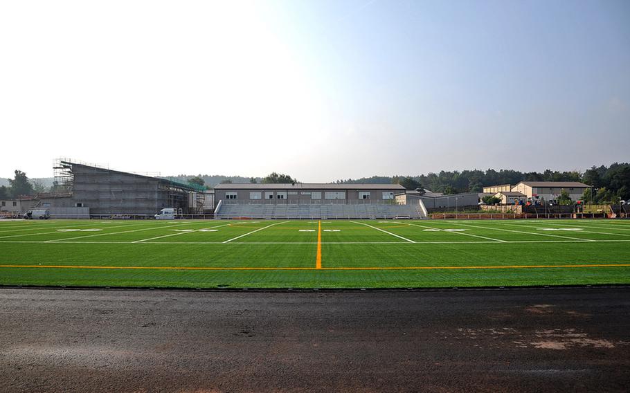 A view of the new Kaiserslautern High School stadium from the 50-yard line. Construction is progressing and should be ready for action in spring 2013. The artificial grass field will be surrounded by an eight-lane track. It will also have facilities for field events. Behind the visitors stands is Kaiserslautern Elementary School. At left it is a new multipurpose room that is under construction, and at far right is the high school gym.
