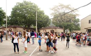 Students take a break during the first day of school at Seoul American Middle School.  