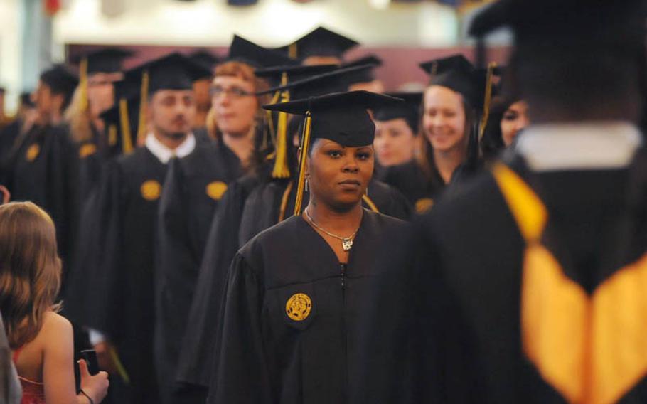 The 2011 University of Maryland University College Europe graduates enter the Village Pavillion in Heidelberg, Germany, at the beginning of their graduation ceremony. About 200 of the 1,100 grads receiving diplomas attended the Saturday afternoon ceremony.