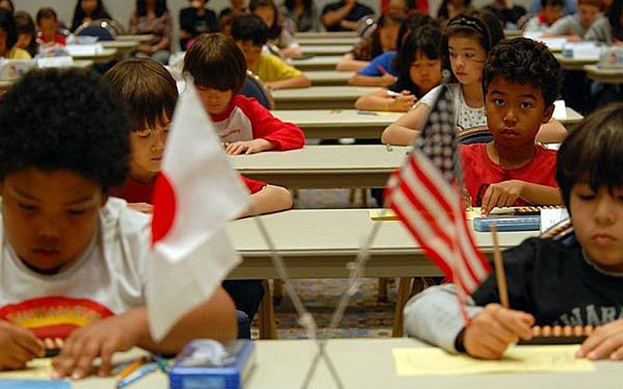 Students from eight elementary and middle schools in Japan compete in the 29th Kanto Area DODDS Soroban Contest at the New Sanno Hotel in Tokyo on Wednesday.