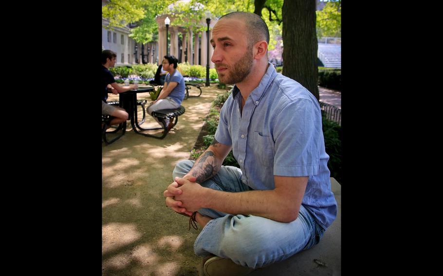 Iraq War veteran Kristofer Goldsmith, sits in a campus park after his last final exam of the semester at Columbia University in New York on May 9, 2018.